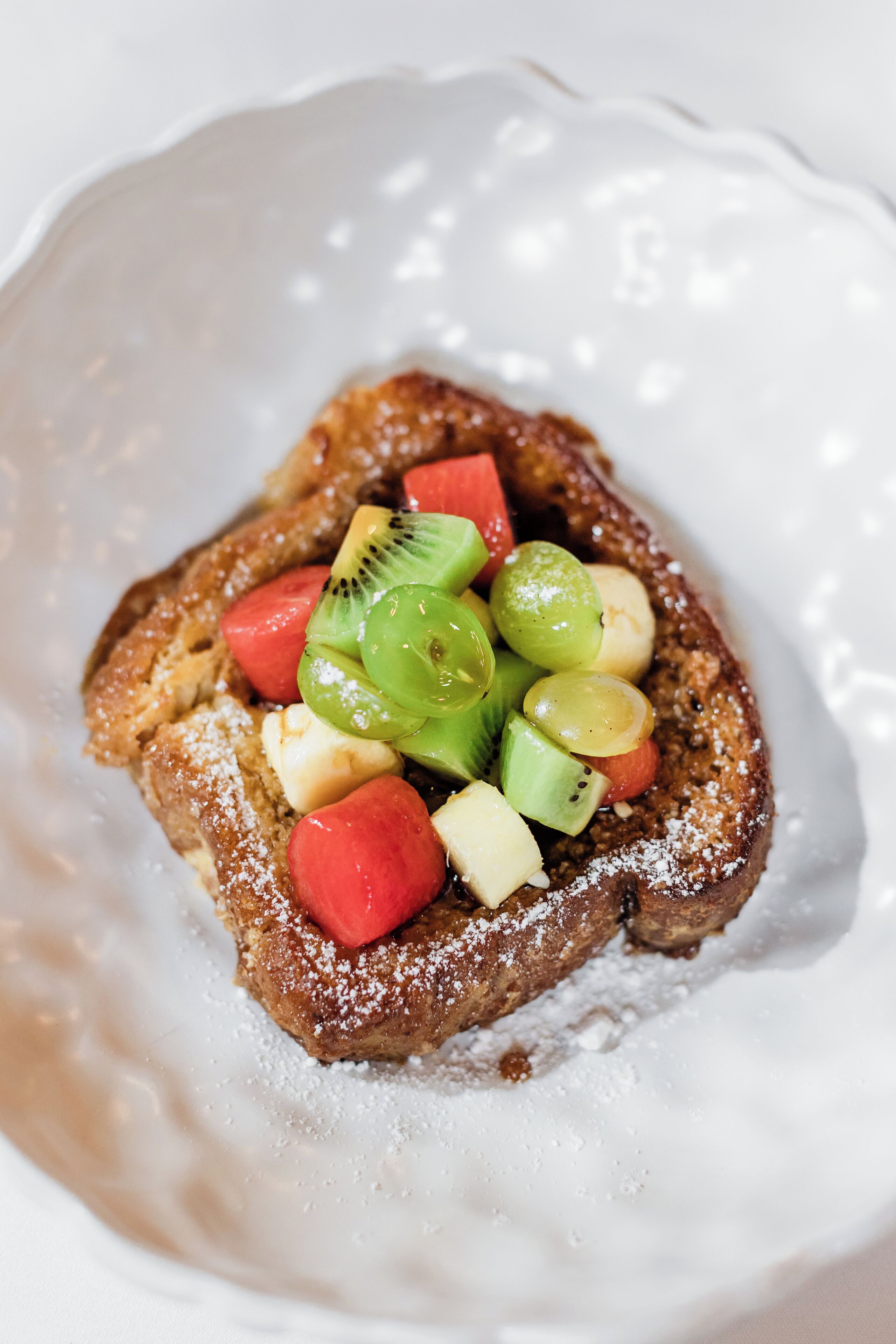 A dessert with fruit on a plate.