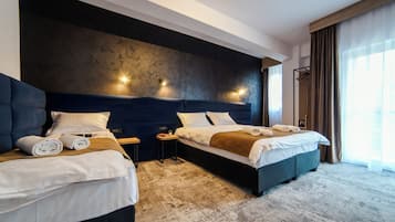Executive Quadruple Room | In-room safe, blackout curtains, iron/ironing board, free WiFi