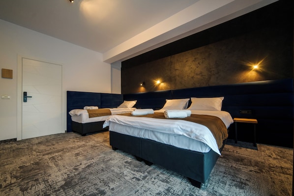 Executive Quadruple Room | In-room safe, blackout drapes, iron/ironing board, free WiFi