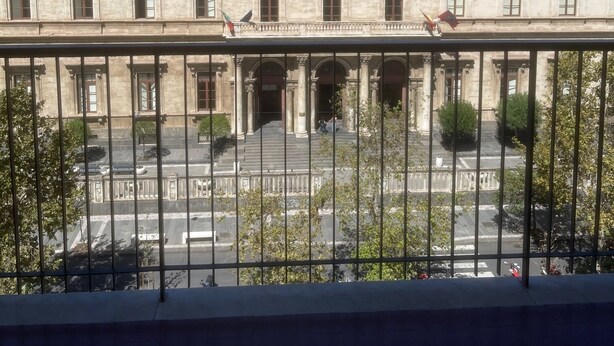 A classical building with a symmetrical facade, large windows, and a central entrance with columns. - Corso Italia 72 (Catania)