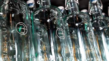 Multiple glass bottles with the text "BRIT HOTELS PUREMADE" and a logo.