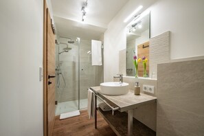 Condo, Garden View | Bathroom | Hair dryer, towels, soap, toilet paper