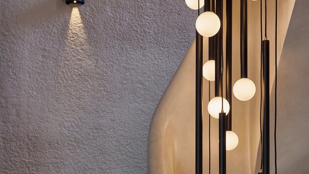 A staircase with a modern light fixture featuring spherical bulbs. - Skiathos Senses (Skiathos)