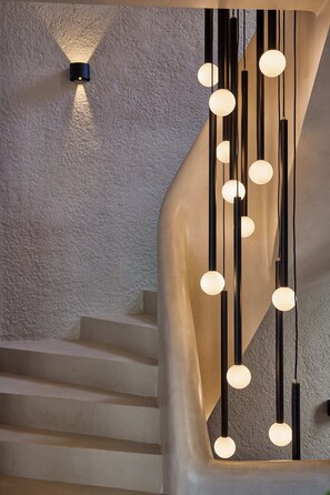A staircase with a modern light fixture featuring spherical bulbs. - Skiathos Senses (Skiathos)