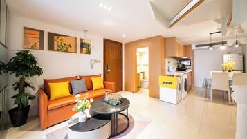 Apartment, Non Smoking | Living area | 55-inch TV with cable channels