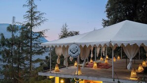 A tented outdoor area with a sign reading "THE ISISINGA". - The Isisinga (Banjar)