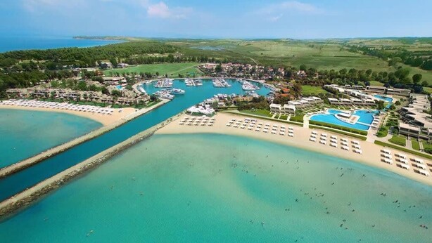 An aerial view of a coastal resort with a marina, beach, and swimming pool. - Elani Private Retreat - Villa Anna Garden Escape (Kassandra)