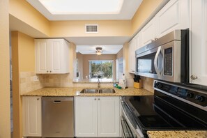 Fridge, microwave, oven, stovetop - Coastal Comfort | 3BR Resort Stay Near Fun (St. Petersburg)