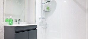 Shower, hair dryer, towels, soap