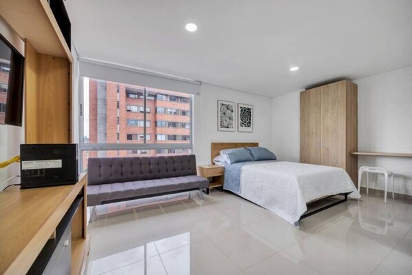 1 bedroom, desk, iron/ironing board, travel crib