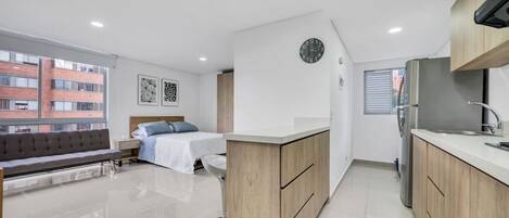 1 bedroom, desk, iron/ironing board, travel crib