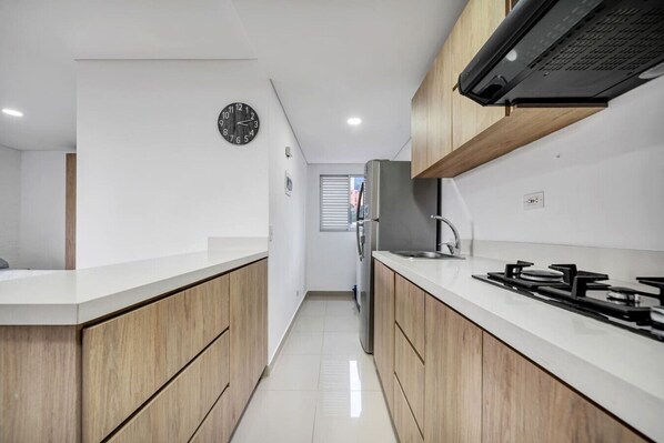 Fridge, microwave, stovetop, coffee/tea maker