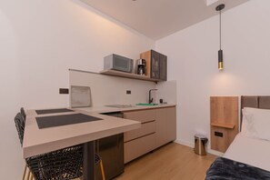 Fridge, microwave, stovetop, coffee/tea maker