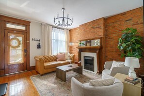 Right when you walk in you`re greeted by our spacious living room —plenty of seating for everyone in your party! - Walkable to Cafes | Fenced in Patio | King Bed (Columbus)