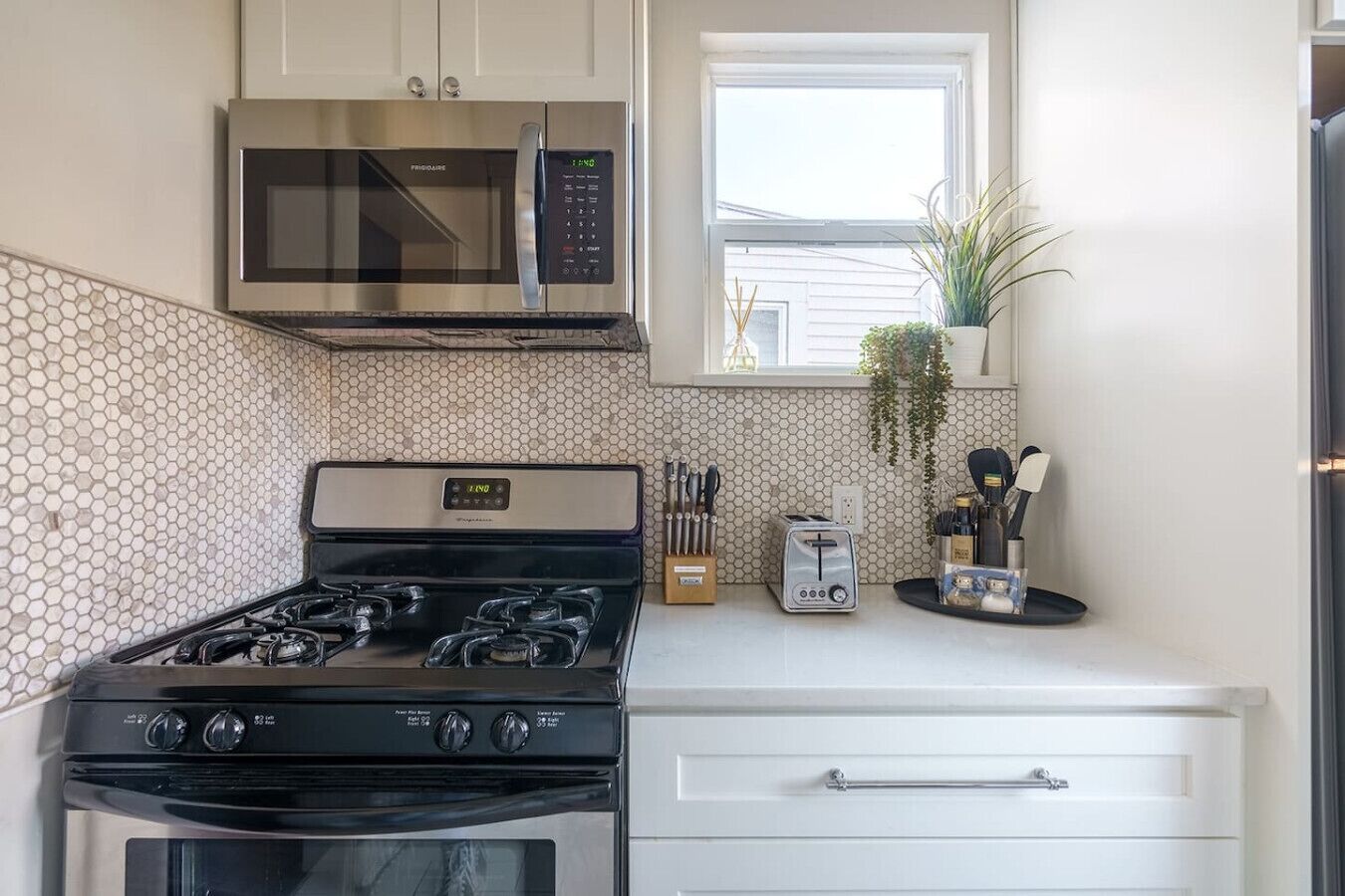 Gas stove, knife block, microwave, toaster, and plenty of cooking utensils so making meals is a breeze.