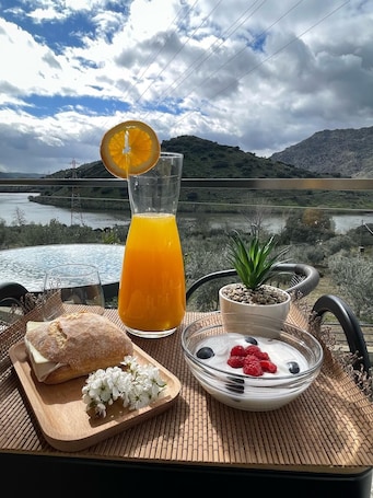 Outdoor dining. Spacious 6-bedroom hotel suites with AC, WiFi in charming Torre de Moncorvo