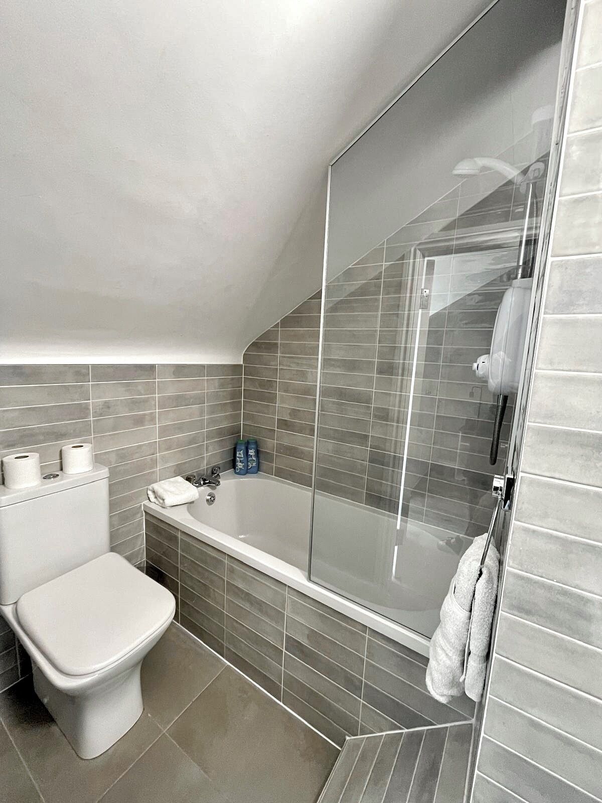 Shower, hair dryer, towels, soap