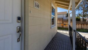 A house with a porch, a door with a keypad lock, and a number '160' sign on the wall. - @ Marbella Lane - Convenient Home in Sunnyvale (Sunnyvale)