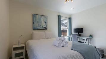 2 bedrooms, desk, laptop workspace, iron/ironing board