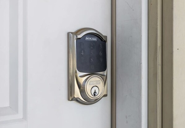 A door with a SCHLAGE electronic keypad lock.