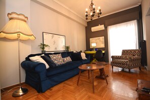 Apartment, Balcony | Living area | 32-inch flat-screen TV with digital channels