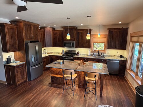 Charming new lake house with beautiful views. Pier for swimming and fishing.