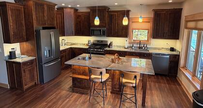 Charming new lake house with beautiful views. Pier for swimming and fishing.