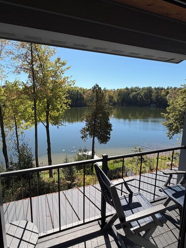 Charming new lake house with beautiful views. Pier for swimming and fishing.