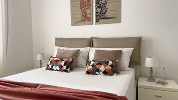 1 bedroom, desk, iron/ironing board, travel crib