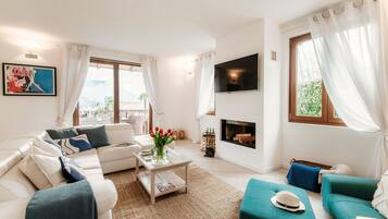 Villa | Living area | 30-inch TV with digital channels