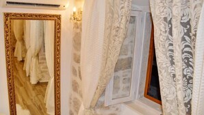 A room with a large mirror, a window with curtains, and a staircase leading to another area. - Villa Madonna della Strada A 3 (Dubrovnik)