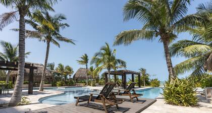 Oceanfront retreat with private balcony, outdoor pool, and stunning views