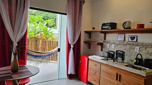 Fridge, oven, coffee/tea maker, cookware/dishes/utensils