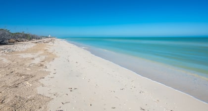 Beachfront apartment with private balcony, heated pool & stunning views