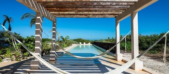 Beachfront apartment with private balcony, heated pool & stunning views