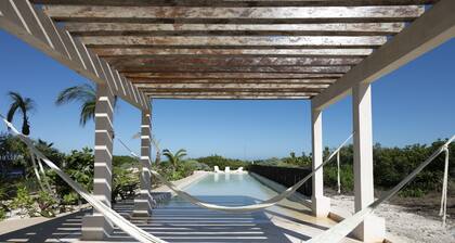 Spacious beachfront apartment with ocean views, private balcony & heated pool