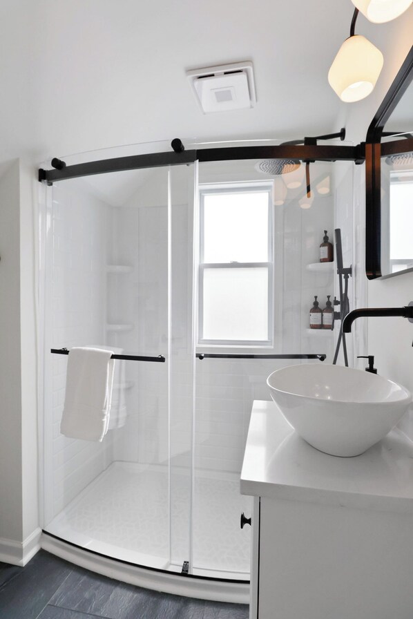 Shower, hair dryer, towels, soap