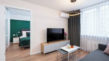 Comfort Apartment, Balcony, City View | Living area | 50-inch Smart TV with satellite channels, Netflix, streaming services