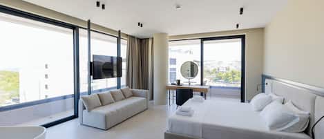 Deluxe Suite, Balcony | 1 bedroom, desk, free WiFi, bed sheets