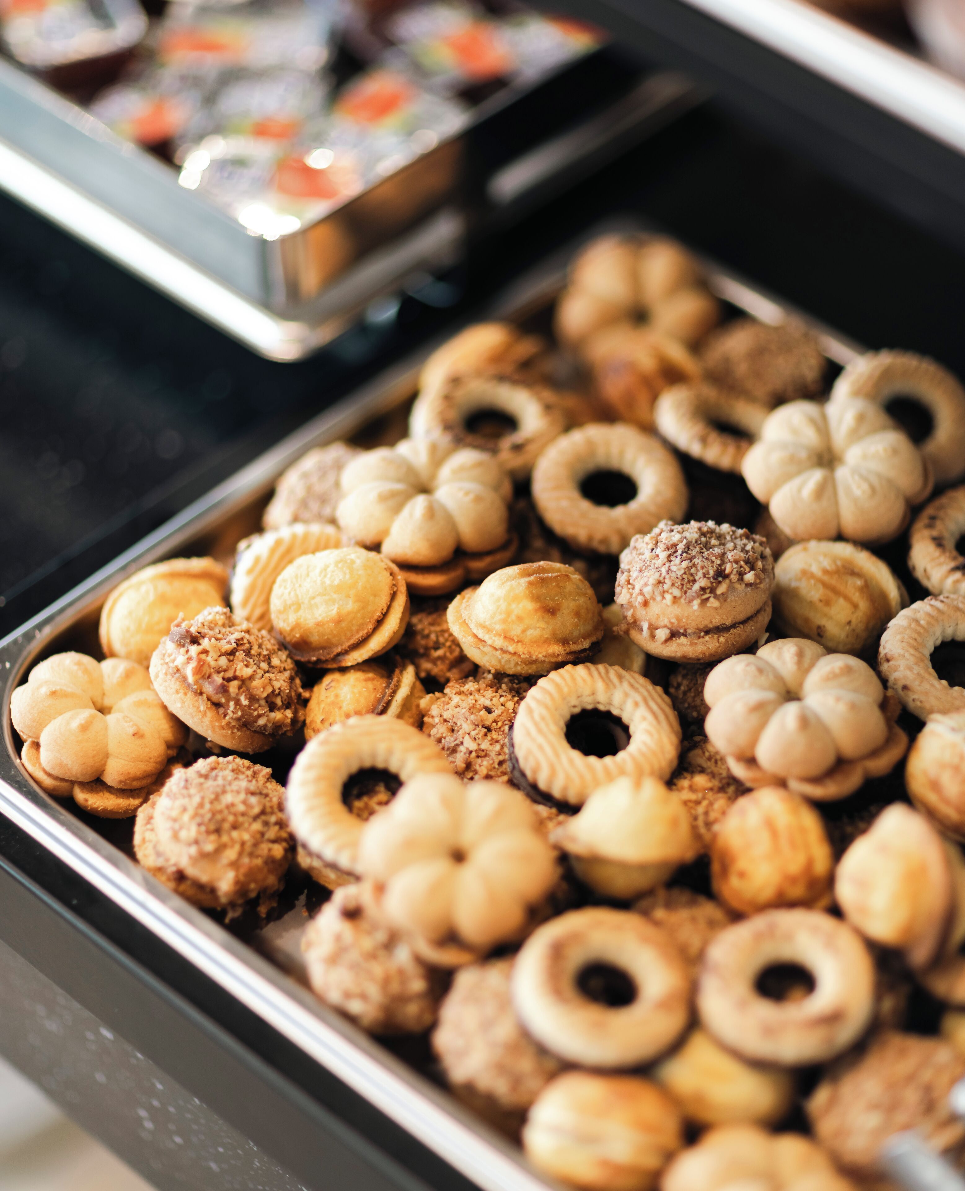 A variety of pastries in a display case.