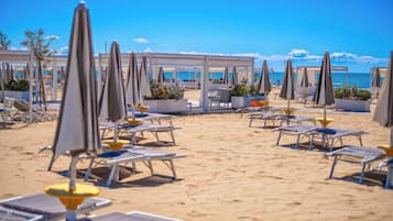 Private beach, white sand, free beach cabanas, sun loungers