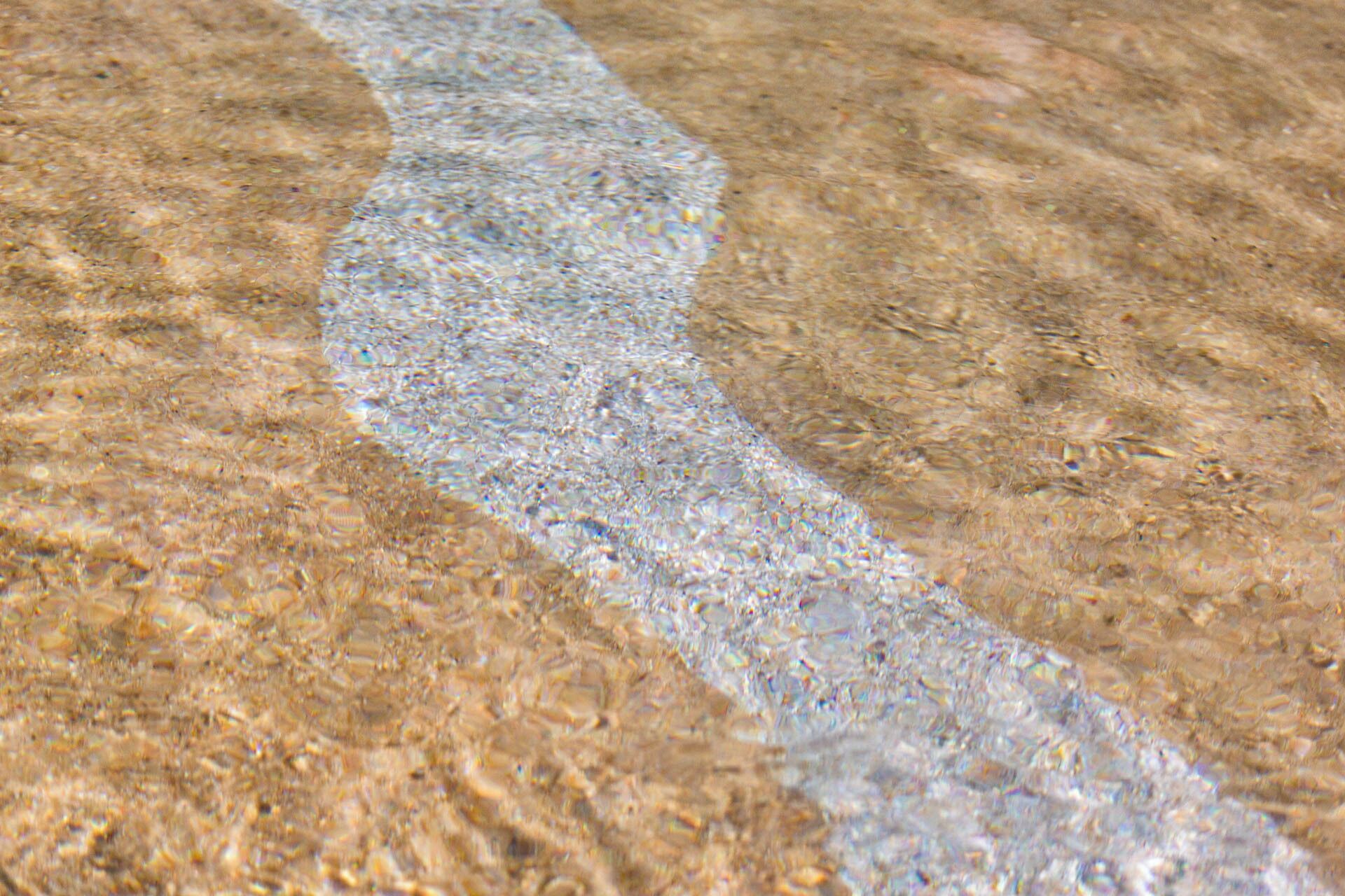 A close-up of a textured surface with a distinct linear pattern.