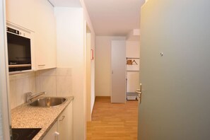 Microwave, stovetop, coffee/tea maker, cookware/dishes/utensils