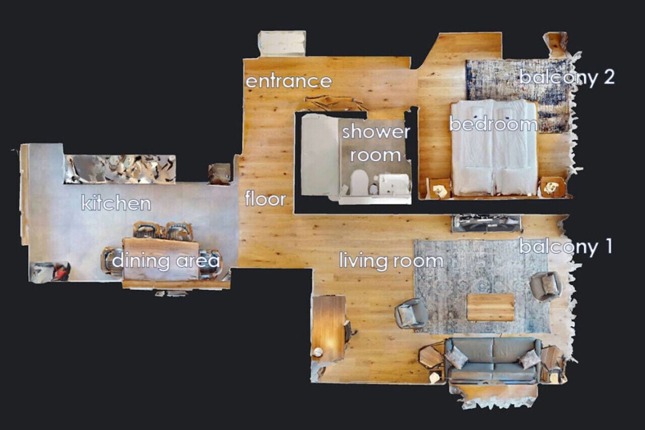 A floor plan of a house with a kitchen, dining area, entrance, living room, bedroom, shower room, balcony 1, and balcony 2.