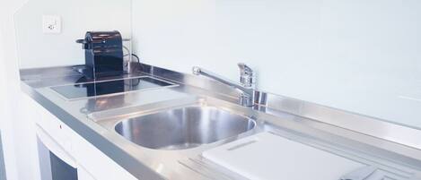 Oven, stovetop, coffee/tea maker, cookware/dishes/utensils