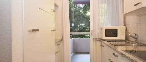 Microwave, stovetop, coffee/tea maker, toaster