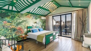 A bedroom with a bed, a mural, a balcony, and a view of the outside. - Your City Pinghua Impression Inn (Kunshan)