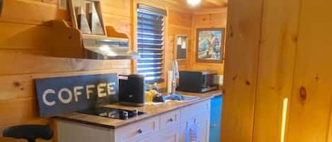 Fridge, microwave, stovetop, coffee/tea maker