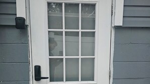A white door with a number '1' above it, a glass panel, and a doorbell. - HOME SWEET HOME, near USF, Bush Gardens, Adventure Island, MOSI, Downtown. (Tampa)