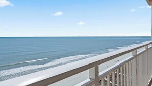 A balcony with a view of the beach and ocean. - Corner, Oceanfront Balcony- Pool- Upscale Design (North Myrtle Beach)